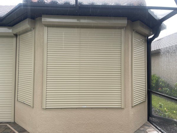 Roll down shutters protecting an entire home for hurricane defense