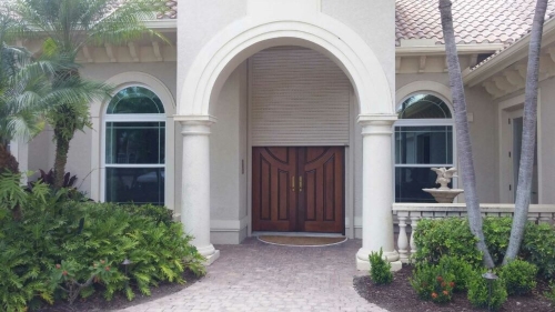 Installation of motorized roll down shutters in Naples, FL and neighboring communities