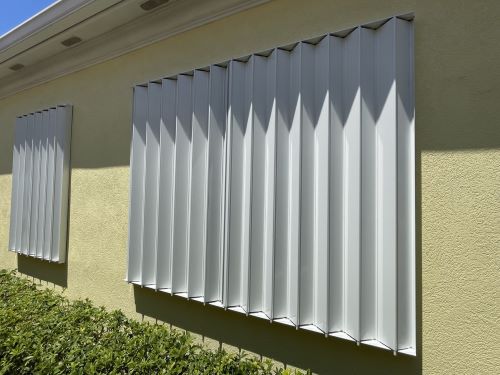 Accordion shutters Installed and custom made for your home with cost saving hurricane protection